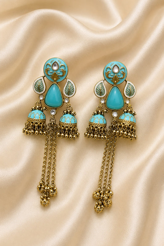 Azure Royale Twin Jhumka Earrings in antique gold finish with turquoise enamel, crystal accents and chain tassels by Rich Rose Jewellery.