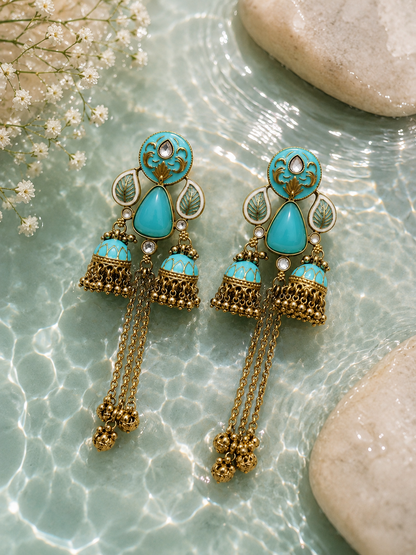 Azure Royale Twin Jhumka Earrings in antique gold finish with turquoise enamel, crystal accents and chain tassels by Rich Rose Jewellery.