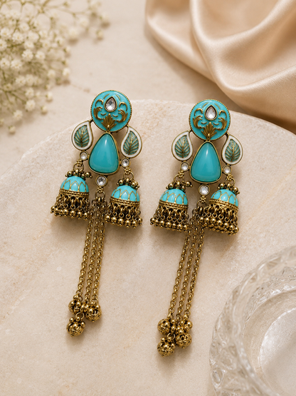 Azure Royale Twin Jhumka Earrings in antique gold finish with turquoise enamel, crystal accents and chain tassels by Rich Rose Jewellery.